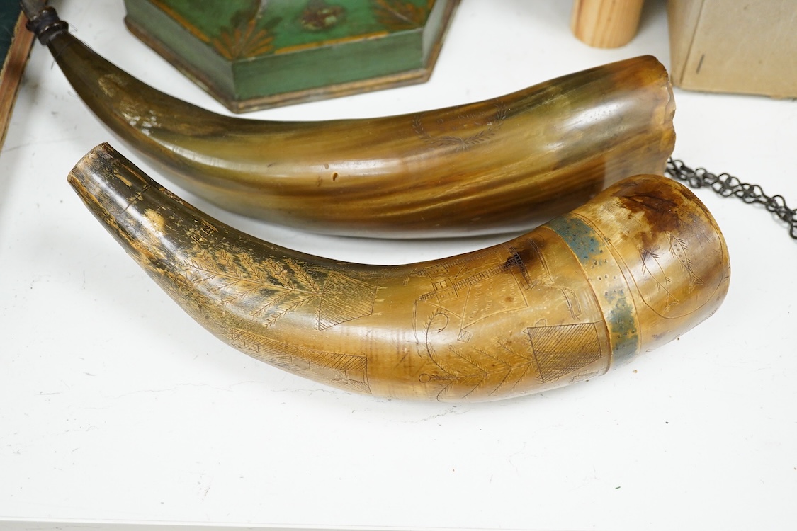 Two scrimshaw engraved cowhorn flasks the first engraved with ships, plants, fish, an anchor, a watering can and various other implements, the second engraved with a Scottish sentimental verse and the owner’s name; D. Fi